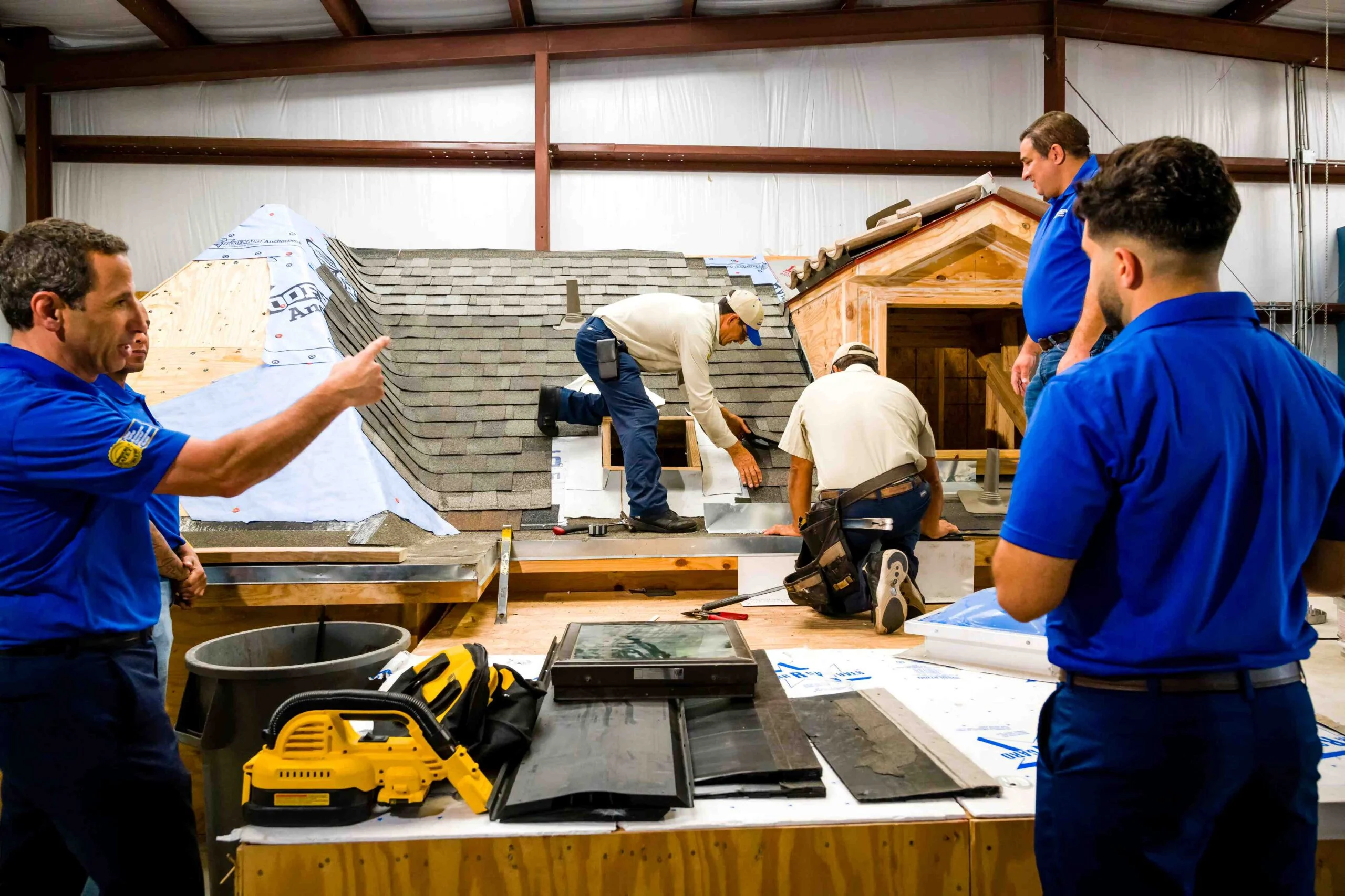 10 Best Roofing Companies in Houston, TX | 2026 Homeowner Guide 5 Precision Roof Crafters Roofing Crew Professional Training on Custom Mock Roof as a top 10 Best Roofing Company in Houston